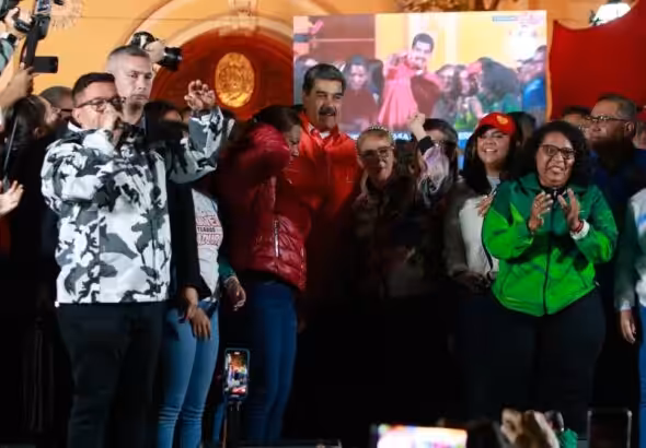 President of Venezuela, Nicolás Maduro, is observed surrounded by supporters, celebrating the election of governors and deputies at a government event early Monday, in Caracas, Venezuela. Photo: Presidential Press.