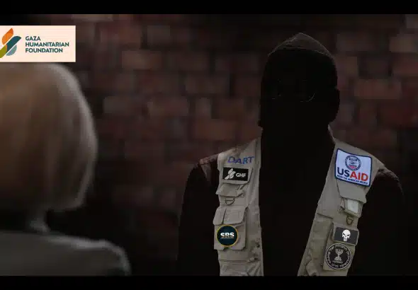 Masked Mossad asset during an interview. Photo: The Grayzone.