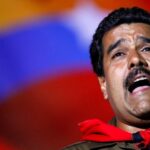 Nicolas Maduro sings during a campaign rally in Caracas, Venezuela, April 5, 2013. Photo: Carlos Garcia.