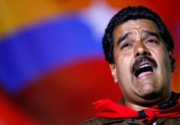 Nicolas Maduro sings during a campaign rally in Caracas, Venezuela, April 5, 2013. Photo: Carlos Garcia.