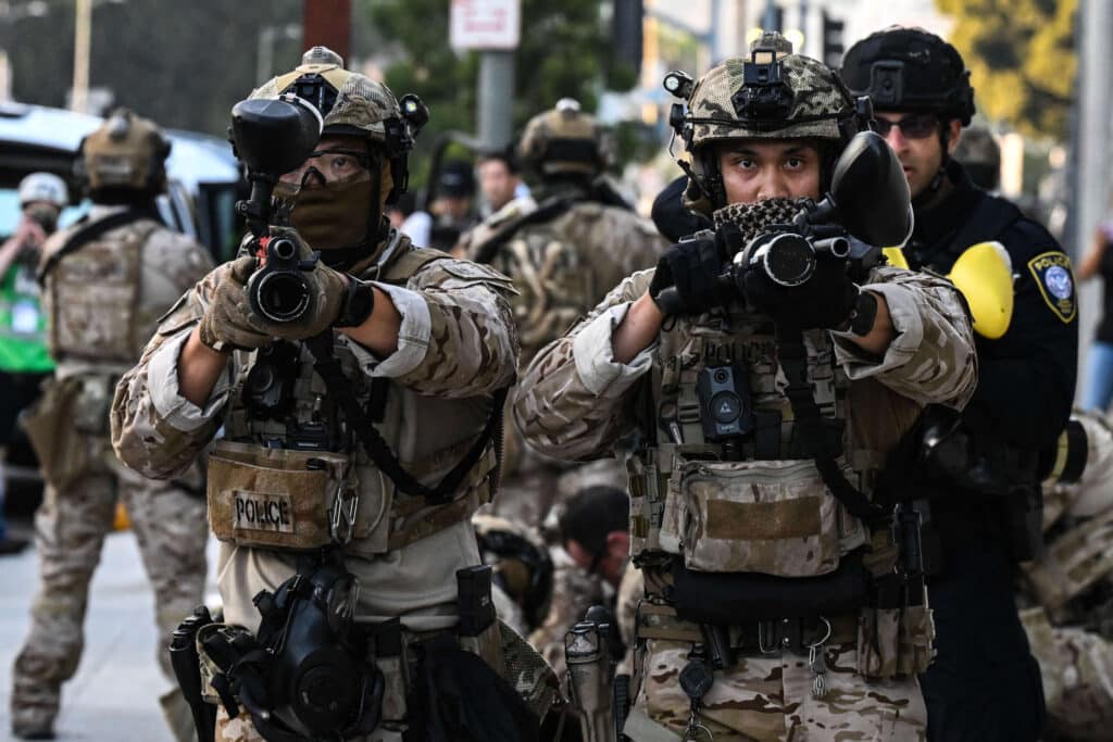 US Customs and Border Protection agents hold up "less-lethal" weapons in front of the Federal Building during ongoing demonstrations in response to federal immigration operations in downtown Los Angeles on June 12, 2025. Photo: Ronaldo Schemidt/ AFP/Getty Images.