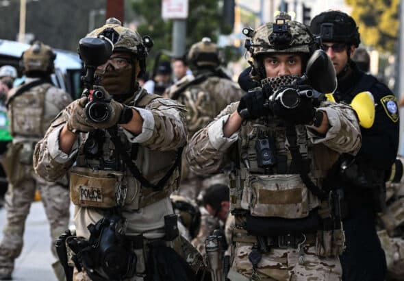 US Customs and Border Protection agents hold up "less-lethal" weapons in front of the Federal Building during ongoing demonstrations in response to federal immigration operations in downtown Los Angeles on June 12, 2025. Photo: Ronaldo Schemidt/ AFP/Getty Images.