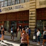 People walking in front of the Cuban Telecommunications Company (ETECSA) building in Havana. Photo: Reuters.