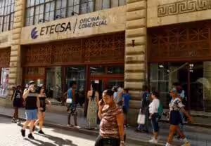 People walking in front of the Cuban Telecommunications Company (ETECSA) building in Havana. Photo: Reuters.
