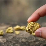 Person holding a gold nugget. Photo: Phawat/Shutterstock/File photo.