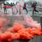 People being tear-gassed while protesting. Photo: Africanews.