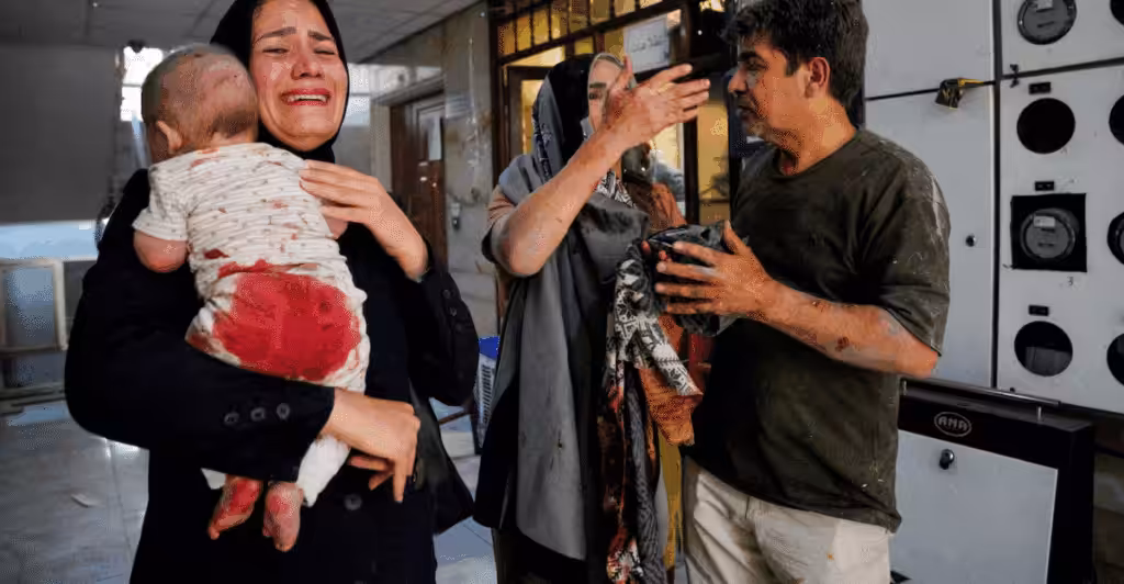 Iranians injured in an Israeli attack on Keshavarz Boulevard in central Tehran. Photo: Amir Kholousi/AFP via Getty Images.