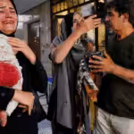 Iranians injured in an Israeli attack on Keshavarz Boulevard in central Tehran. Photo: Amir Kholousi/AFP via Getty Images.