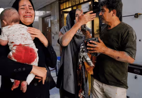 Iranians injured in an Israeli attack on Keshavarz Boulevard in central Tehran. Photo: Amir Kholousi/AFP via Getty Images.