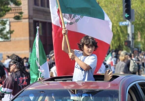 A child holds the Mexican flag in an anti-ICE protest in Los Angeles. Photo: PSL.