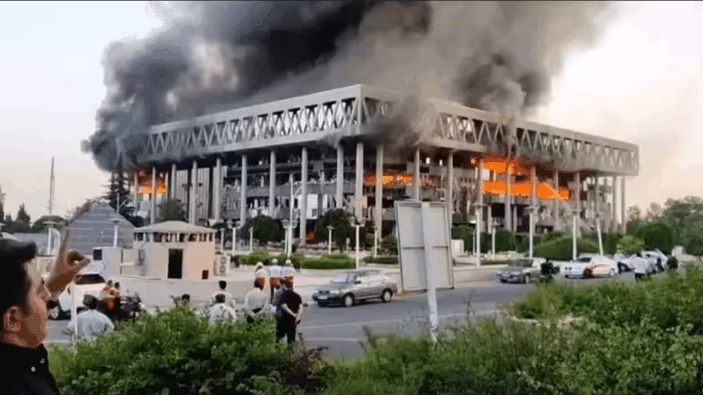 Smoke pours out of the building of Iran's national broadcaster after it was targeted by the Zionist entity. Photo: IRIB.