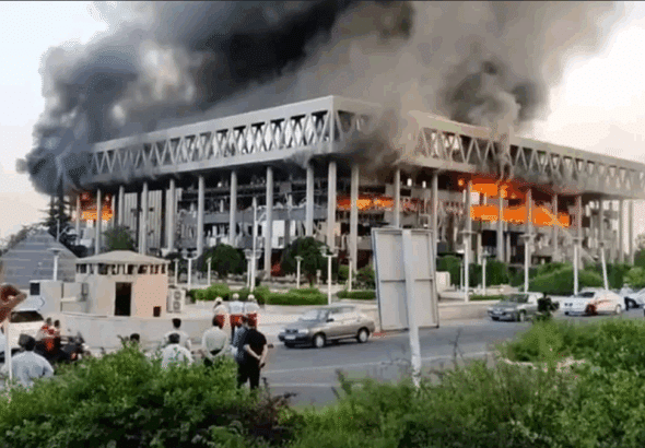 Smoke pours out of the building of Iran's national broadcaster after it was targeted by the Zionist entity. Photo: IRIB.