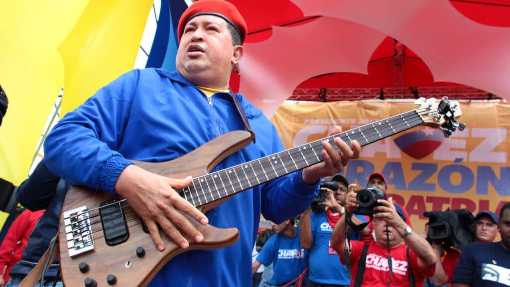 Late Venezuelan President Hugo Chávez holding an electric guitar during a political rally. Photo: File photo.