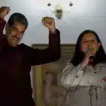 Venezuelan President Nicolas Maduro shows his reaction after the Chavista victory in the municipal elections as he stands next to Carmen Melendez, the re-elected mayor of Caracas. Photo: AP.