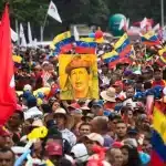Revolutionary PSUV demonstrators displaying the image of Hugo Chavez. Photo: Marcos Salgado/Xinhua.