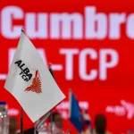 A tabletop stand-sized flag of ALBA-TCP.  File photo.