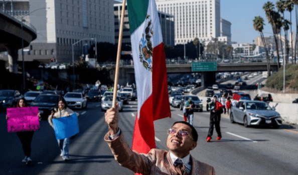 Erik "Neat" Martinez marches along US Route 101 during a protest against arrests and deportations of migrants by US government agencies in Los Angeles, California, February 2, 2025. Photo: Joel Angel Juarez/Reuters.