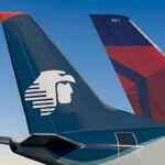 Tails of Delta and Aeromexico passenger jets. File photo.