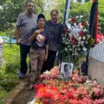 Nicaraguan revolutionary Sócrates’ sister Abigail (in front), son Edwin and daughter Paola, at his grave on June 28, 2025. Photo: John Perry.