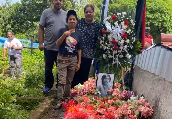 Nicaraguan revolutionary Sócrates’ sister Abigail (in front), son Edwin and daughter Paola, at his grave on June 28, 2025. Photo: John Perry.