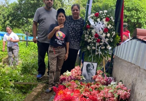 Nicaraguan revolutionary Sócrates’ sister Abigail (in front), son Edwin and daughter Paola, at his grave on June 28, 2025. Photo: John Perry.