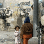 US soldiers from the Army's 82nd Airborne Division patrol Baghdad's Haifa Street district on January 30, 2005. Photo: Charles Onians/AFP.