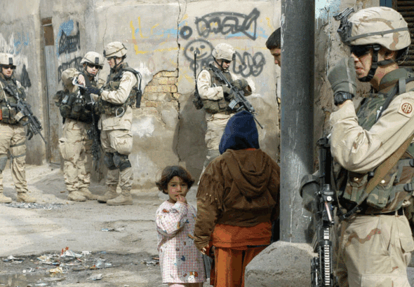 US soldiers from the Army's 82nd Airborne Division patrol Baghdad's Haifa Street district on January 30, 2005. Photo: Charles Onians/AFP.