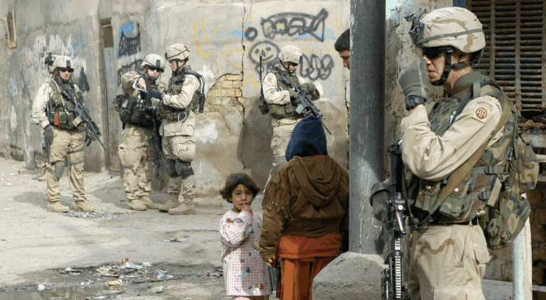 US soldiers from the Army's 82nd Airborne Division patrol Baghdad's Haifa Street district on January 30, 2005. Photo: Charles Onians/AFP.