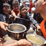 A charity kitchen at a camp for displaced people in Gaza City, May 21, 2025. Photo: Majdi Fathi/Getty Images.