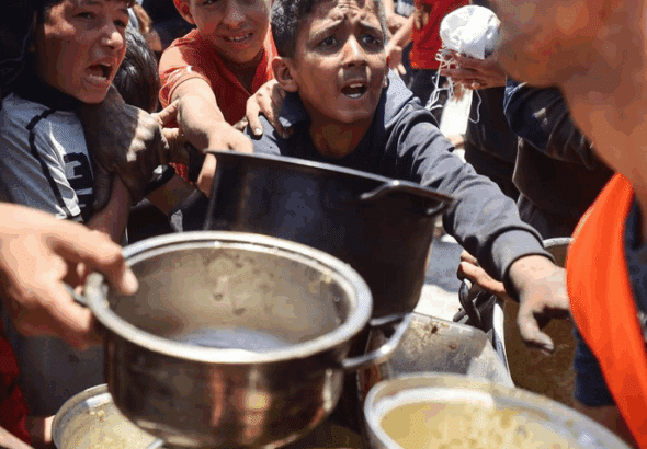 A charity kitchen at a camp for displaced people in Gaza City, May 21, 2025. Photo: Majdi Fathi/Getty Images.