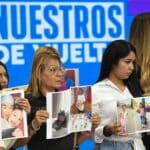 Family members of Venezuelan children abducted by the US authorities hold their photos at a press conference in the National Assembly of Venezuela, in Caracas, June 30, 2025. Photo: Xinhua/Marcos Salgado.