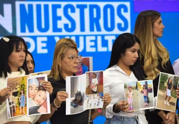 Family members of Venezuelan children abducted by the US authorities hold their photos at a press conference in the National Assembly of Venezuela, in Caracas, June 30, 2025. Photo: Xinhua/Marcos Salgado.