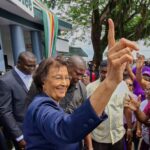Jennifer Geerlings-Simons (center) greets well-wishers in Paramaribo after parliament appoints her as Suriname’s first female president. Photo: AP.