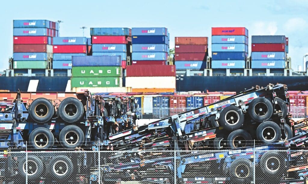 Shipping containers are stacked behind truck flatbeds at the Port of Long Beach, California, on April 2, 2025. Photo: VCG.
