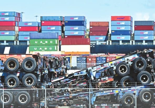 Shipping containers are stacked behind truck flatbeds at the Port of Long Beach, California, on April 2, 2025. Photo: VCG.