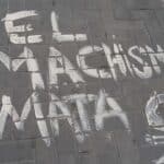 Painting on a sidewalk reading “Machismo Kills.” File photo.