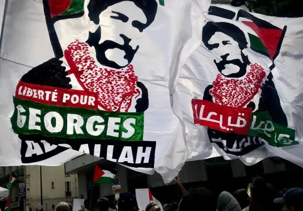 Banners stating 'Freedom For Georges Abdullah,' commemorating the 63rd anniversary of the Algerian people's victory against French colonialism, in Paris, France, July 5, 2025. Photo: X/@SamidounPB.