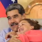 Venezuelan President Nicolás Maduro holding one of the seven children rescued from the United States at Miraflores Palace, Caracas, on Friday, July 18, 2025. Photo: Presidential Press.