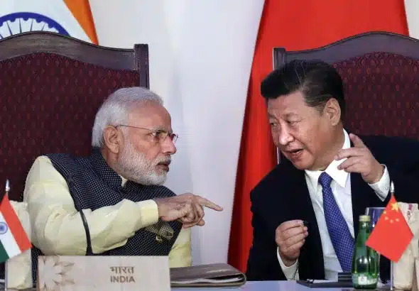 Indian Prime Minister Narendra Modi, left, talking with Chinese President Xi Jinping in 2016. Photo: AP/Manish Swarup.