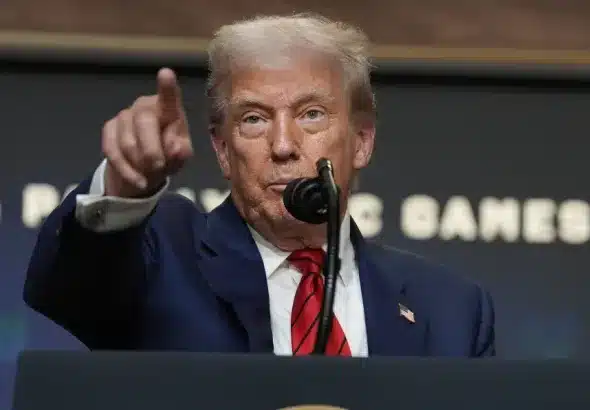 President Donald Trump answers questions from reporters after signing an executive order about the 2028 Los Angeles Olympic Games, in the South Court Auditorium of the Eisenhower Executive Office Building on the White House campus, August 5, 2025. Photo: AP.