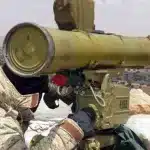 A handout picture released by the Hezbollah press office on May 13, 2015, shows a Hezbollah fighter aiming his weapon on the Syrian side of the Qalamun hills close to the Lebanese border. Photo: AFP Photo/Hezbollah press office.