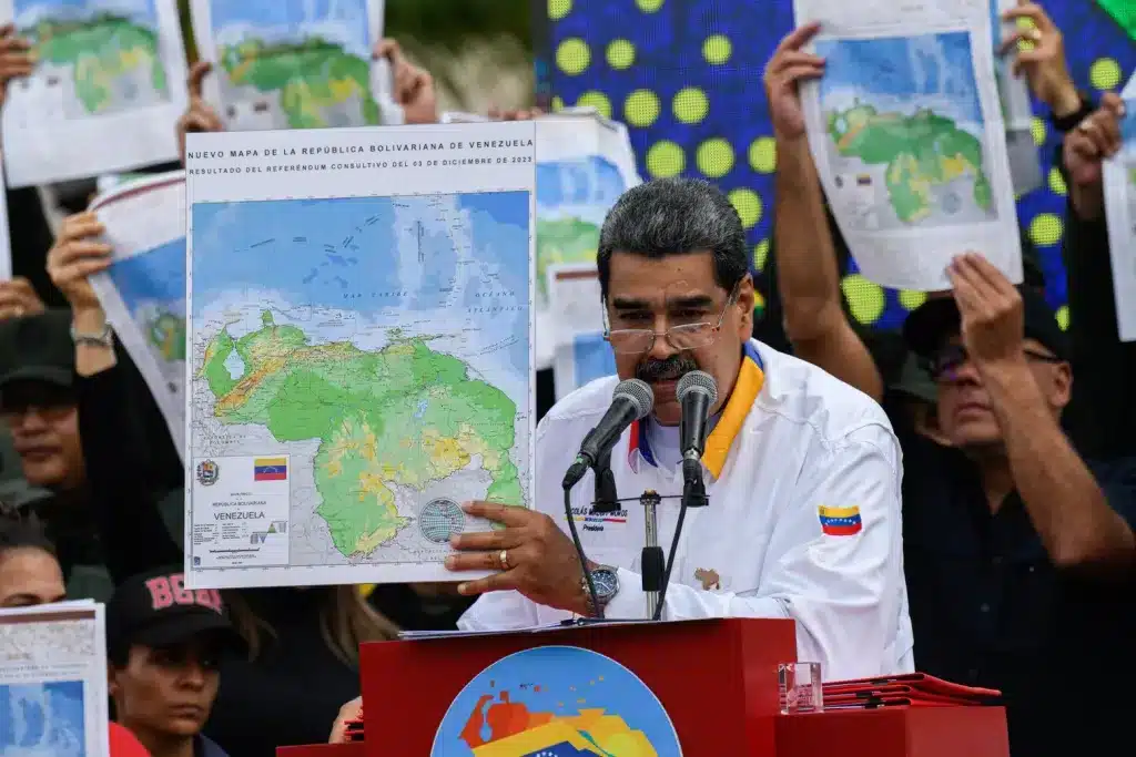 Venezuelan President Nicolás Maduro holds up the map of Venezuela showing Essequibo as an intergal part of the country after the results of the consultative referendum was declared, December 2023. File photo.