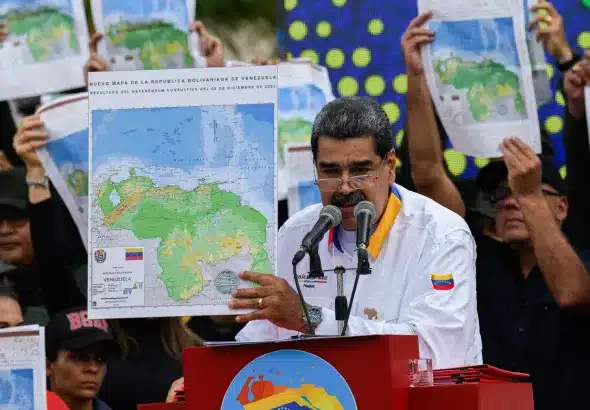 Venezuelan President Nicolás Maduro holds up the map of Venezuela showing Essequibo as an intergal part of the country after the results of the consultative referendum was declared, December 2023. File photo.