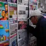 A man looks at newspapers front pages the day after presidential and legislative elections in La Paz, Bolivia. Photo: The Morning Star Shop.