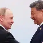 Russian President Vladimir Putin (left) and Chinese President Xi Jinping (right), during a family photo session at the Shanghai Cooperation (SCO) summit in Tianjin, China, Monday, Sept.1. Photo: AP.