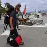 A member of the Global Sumud Flotilla entering the marina in Barcelona, Spain. Photo: AP.