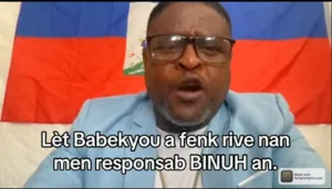 Jimmy “Barbecue” Chérisier reading his letter to BINUH Chief Carlos Ruiz-Massieu. Photo: Haiti Liberté.