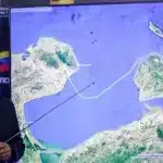Venezuelan Interior Minister Diosdado Cabello shows on a map the route that a US false flag drug vessel had followed before being captured by Venezuelan authorities. Photo: MIPPCI.