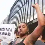 A woman holds a sign that reads ""Presão para Bolsonaro!"!" On January 8, 2024, a demonstration was held in São Paulo to commemorate the first anniversary of the attempted coup in Brasília. Photo: Elineudo Meira/@fotografia.75,