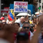 The sign reads, “Respect Venezuela!”, Sept. 5, 2025. Photo: EFE.